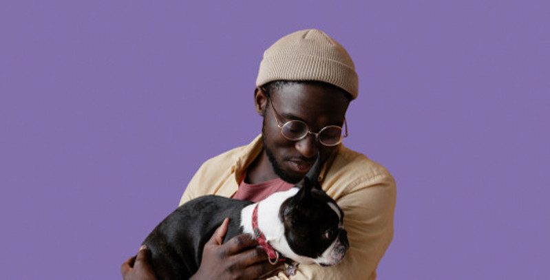 Man holding a dog